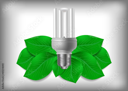 Energy saving bulb and green leaves
