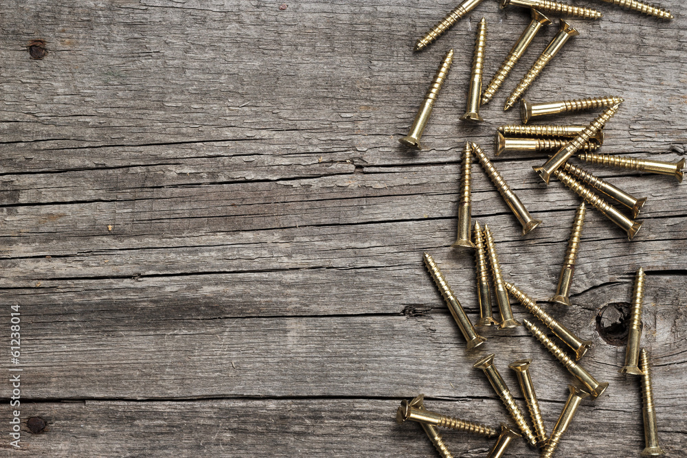 yellow screws on the wooden table yellow screws on the wooden table