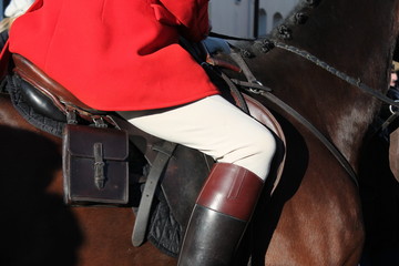 fox hunt Huntsman ready for hunting on horse with saddle and red jacket coat background stock photo photograph image picture 