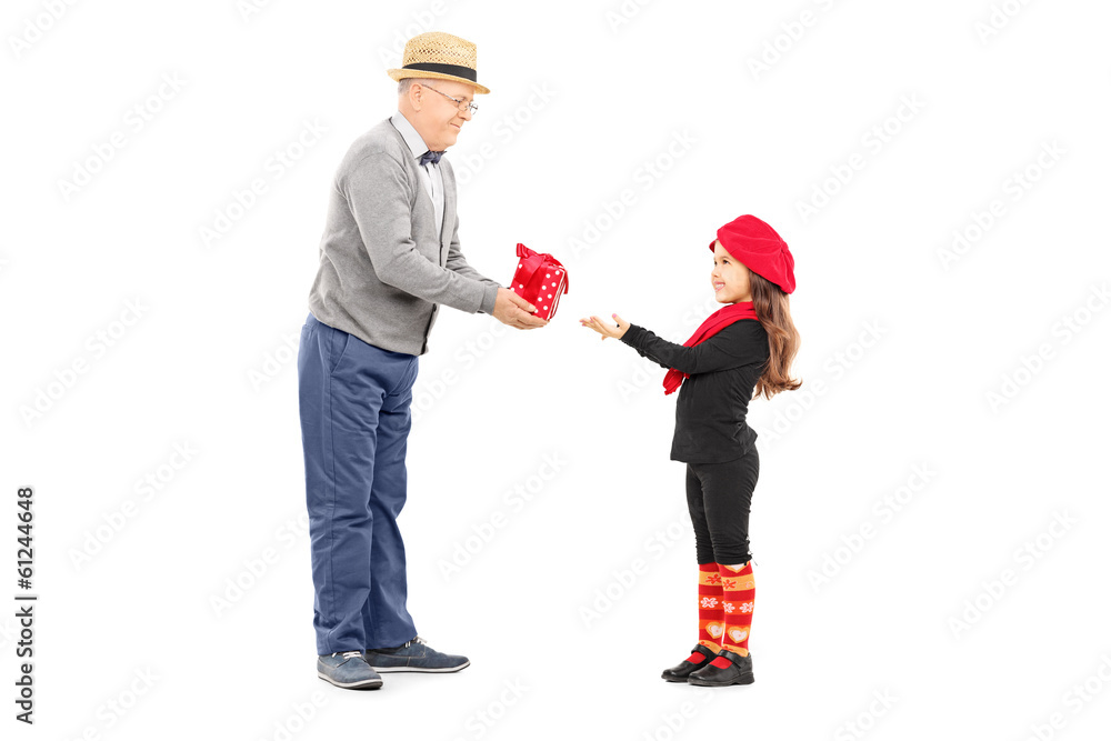 Grandfather giving present to his little niece Grandfather giving present to his little niece