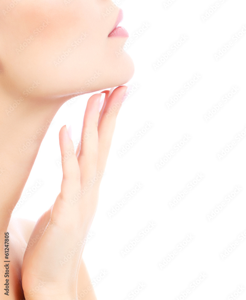 Young female touches her neck, white background, copyspace Young female touches her neck, white background, copyspace