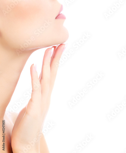Young female touches her neck  white background  copyspace