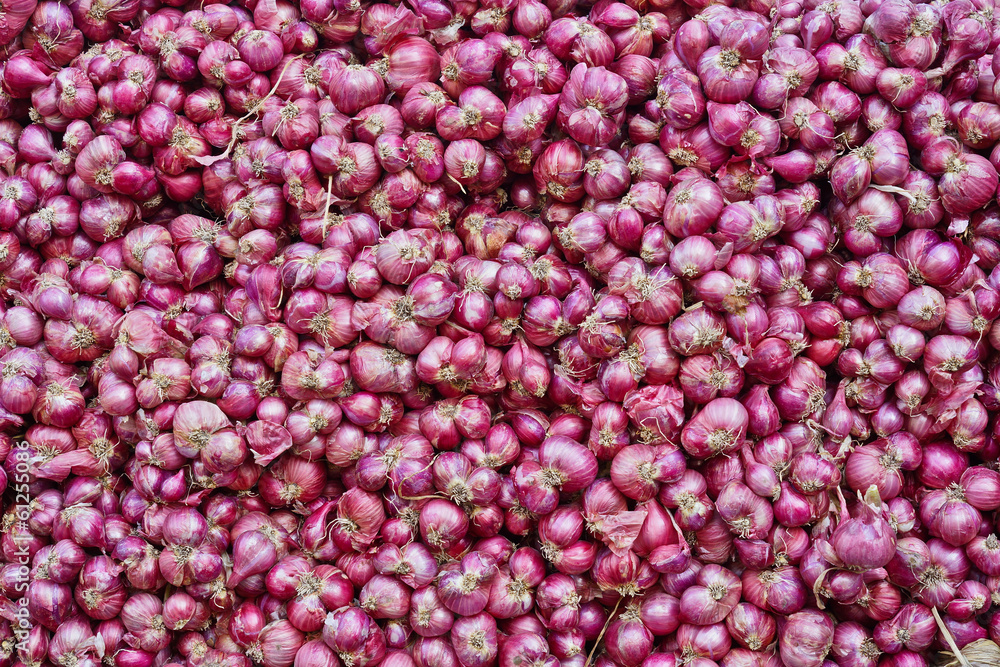 a pile of red onions a pile of red onions