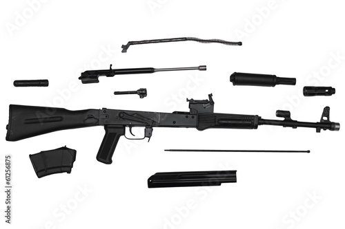 Assault rifle disassembled into parts isolated on white