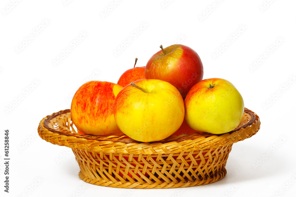 Many apples in a straw basket Many apples in a straw basket