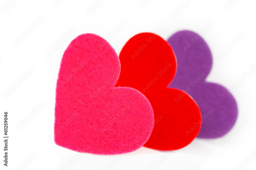 Obraz premium Three colored heart shapes