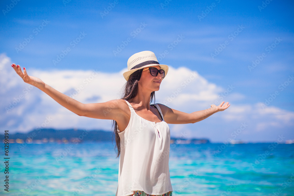 Young beautiful woman enjoying the holiday on white tropical Young beautiful woman enjoying the holiday on white tropical