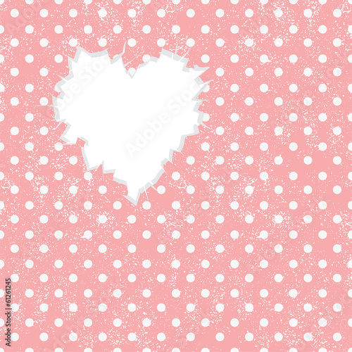Hole in heart shape on Polka dot background