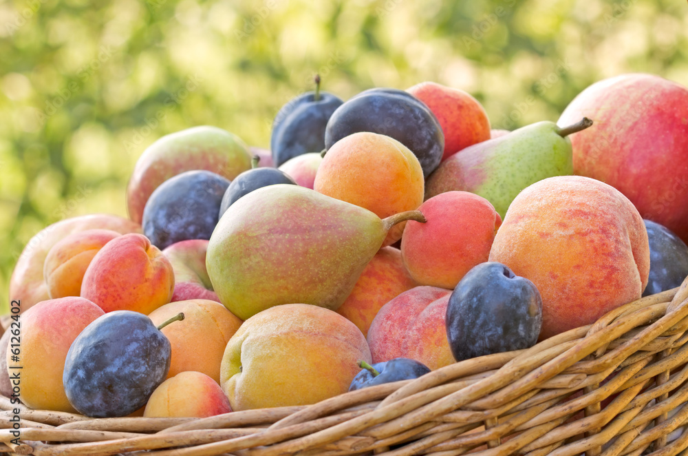 Organic fruits in a wicker basket Organic fruits in a wicker basket