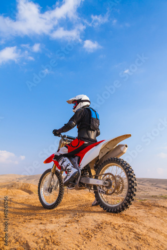 racer on a motorcycle in the desert