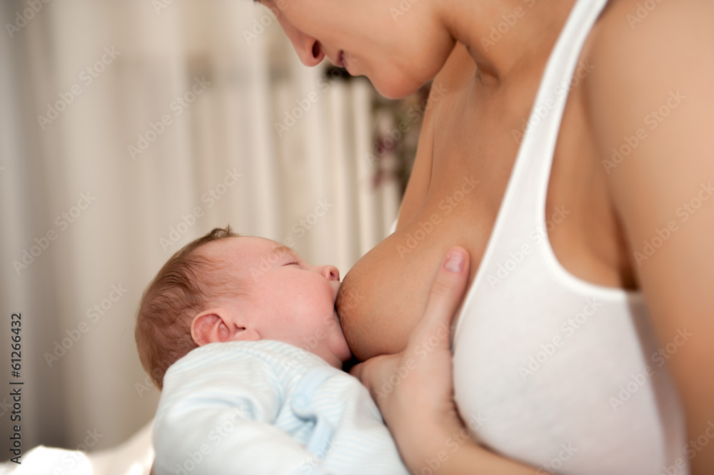 Mother feeding her son Mother feeding her son