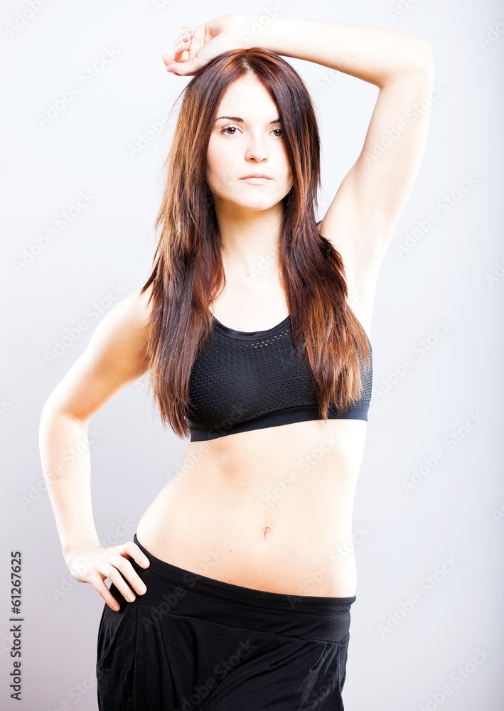 Young athletic woman posing in sports bra Young athletic woman posing in sports bra