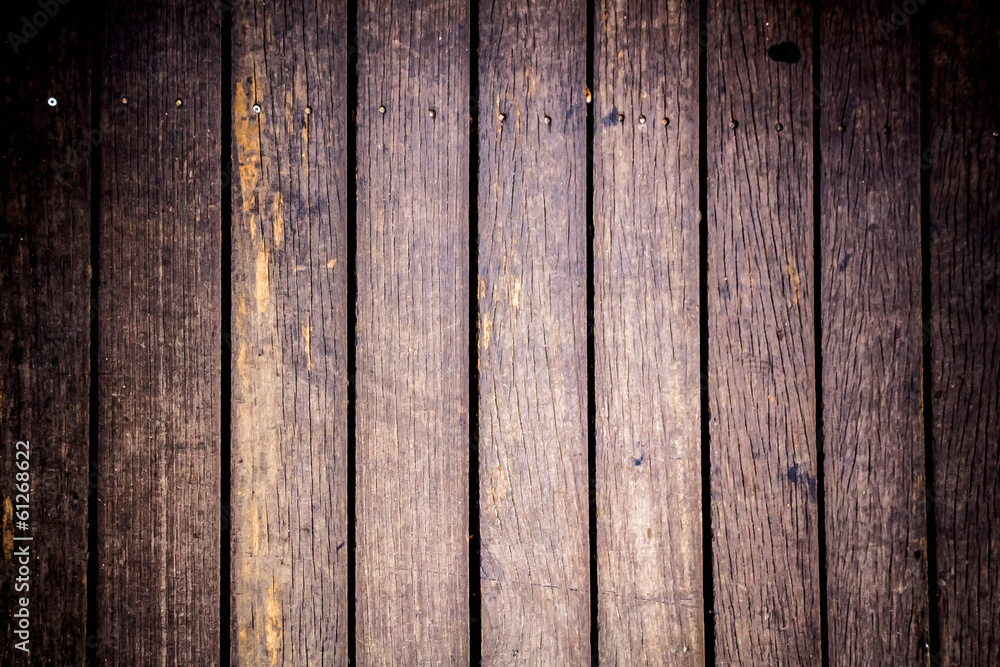 Background of wooden board with center soft light Background of wooden board with center soft light
