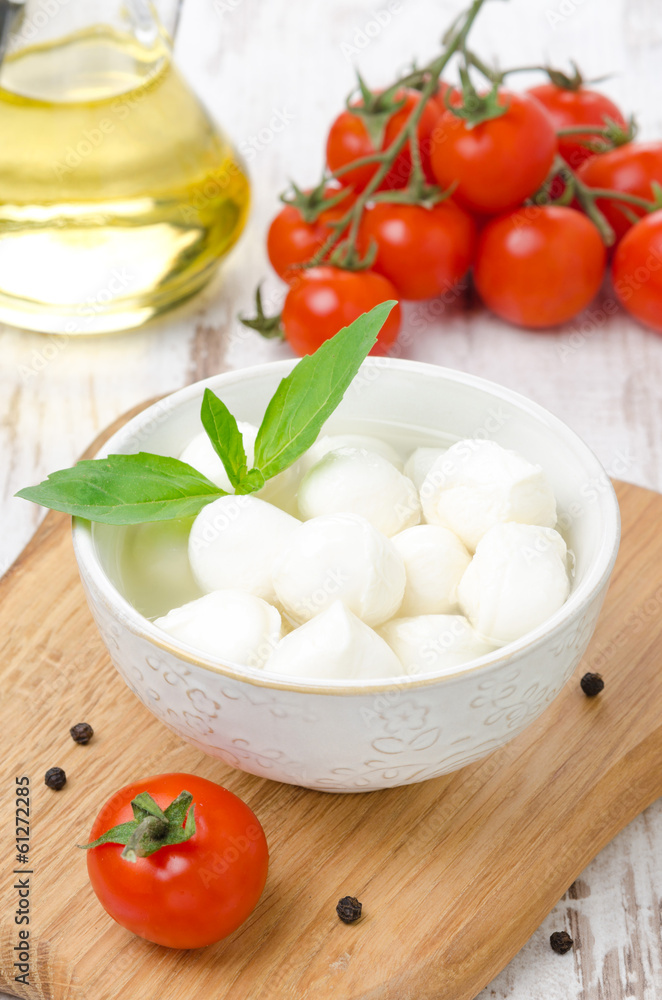 fresh mozzarella in a bowl and cherry tomatoes fresh mozzarella in a bowl and cherry tomatoes
