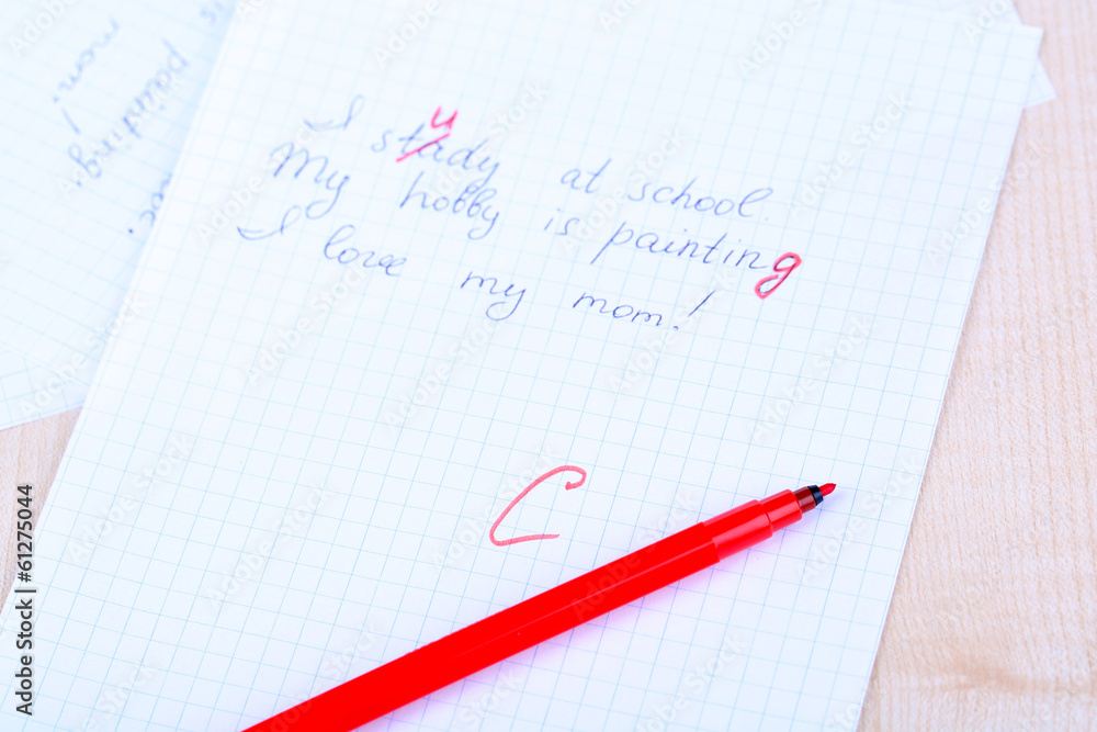 Grade written on an exam paper, close-up Grade written on an exam paper, close-up