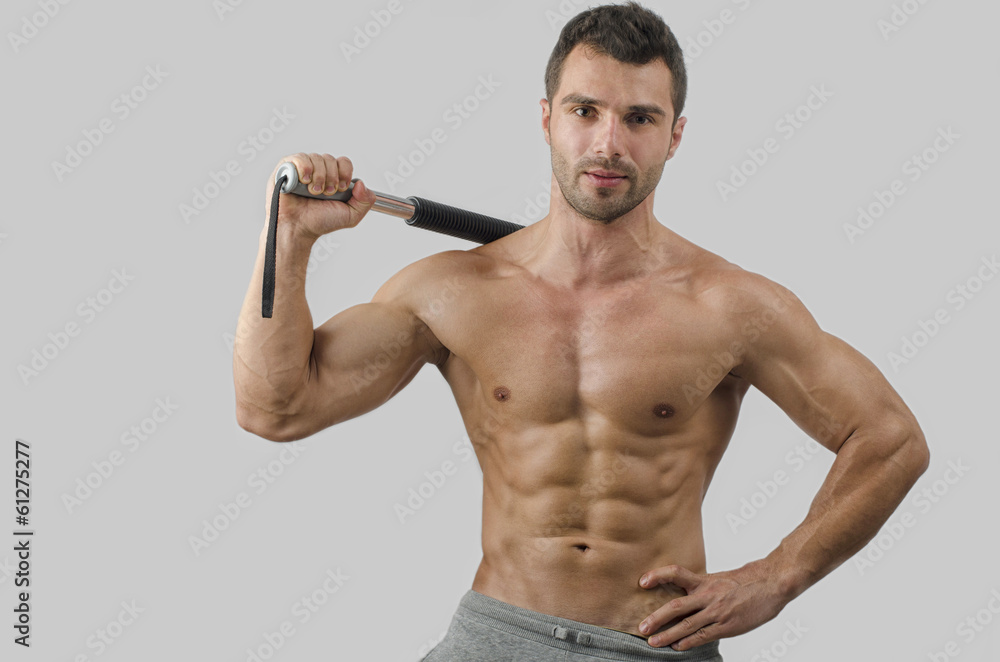 Bodybuilder training with a bendy bar abs chest biceps Stock Photo