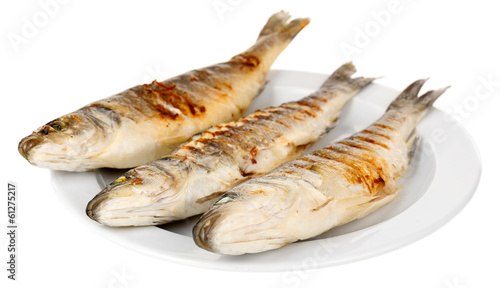 Delicious grilled fish on plate isolated on white