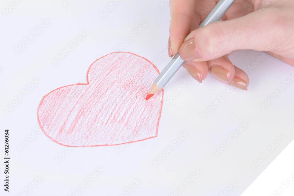 Heart drawn in pencil on a paper sheet close-up Heart drawn in pencil on a paper sheet close-up
