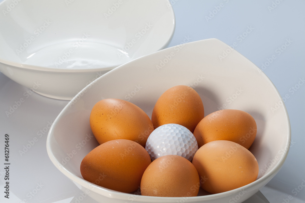 White bowls, easter eggs and golf balls White bowls, easter eggs and golf balls