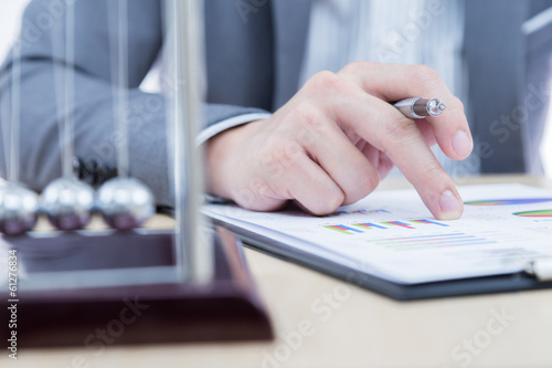 Businessman's hand showing financial report