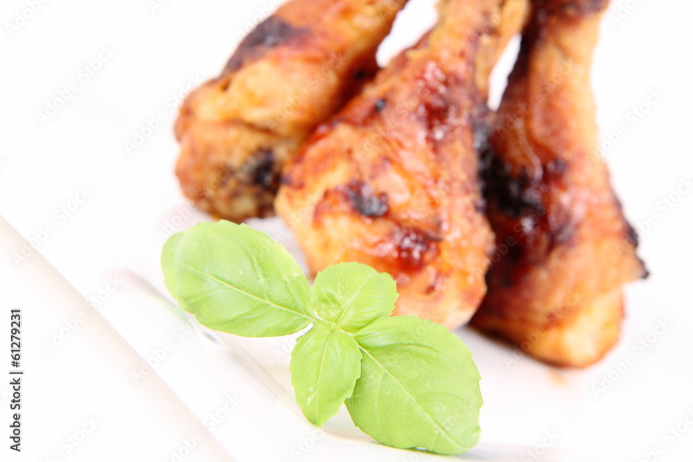 Fried chicken legs decorated with basil Fried chicken legs decorated with basil