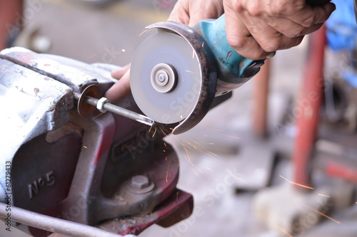 Smoothing steel by grinder for construction building 