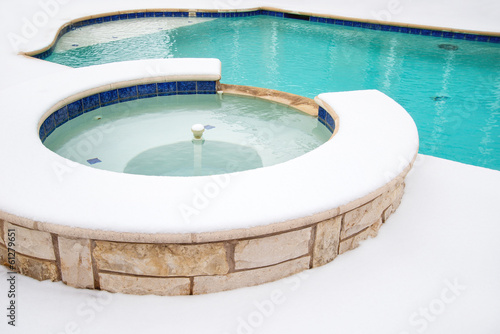 Cuadro en lienzo Outdoor hot tub or spa by swimming pool in the winter
