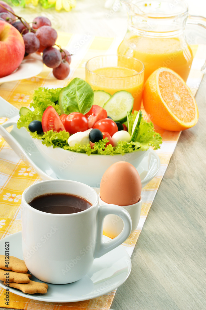 Breakfast with coffee, orange juice, croissant, egg, vegetables Breakfast with coffee, orange juice, croissant, egg, vegetables