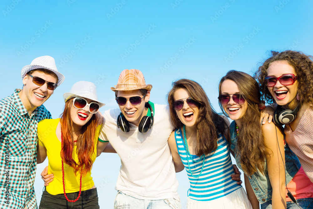 group of young people wearing sunglasses and hat group of young people wearing sunglasses and hat