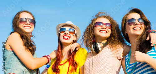 group of young people wearing sunglasses and hat © adam121