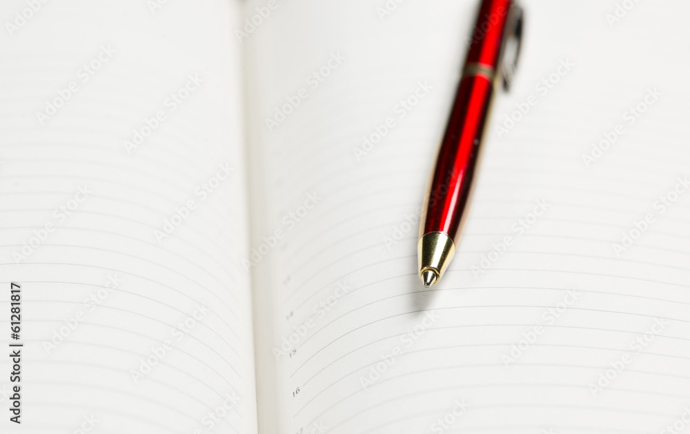 pen and open notepad pen and open notepad