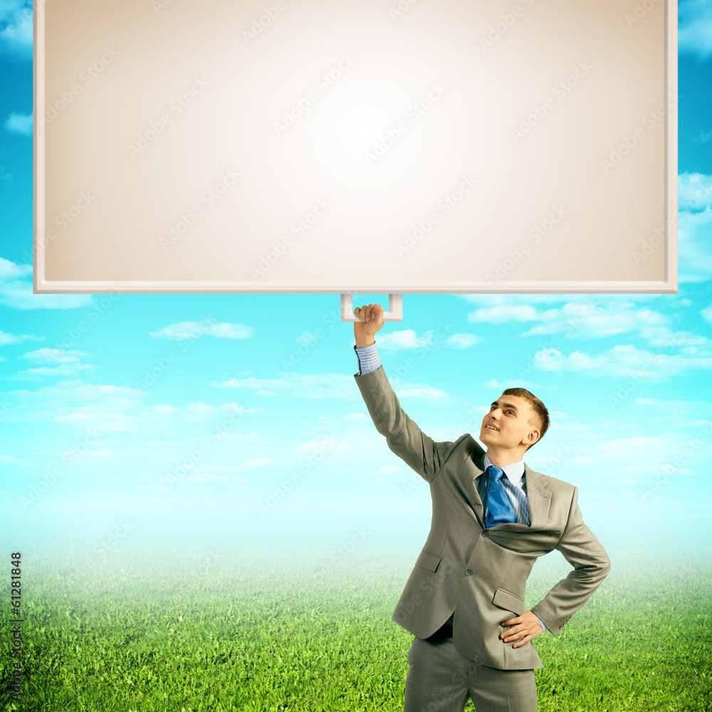 businessman holding a banner with one hand businessman holding a banner with one hand
