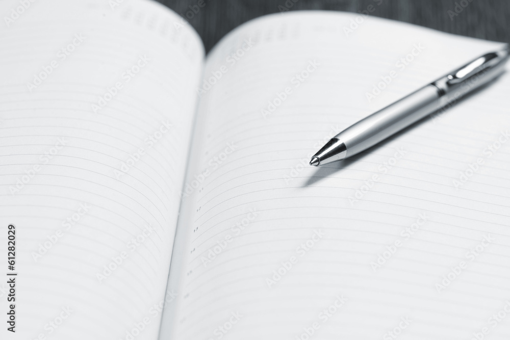 pen and open notepad pen and open notepad