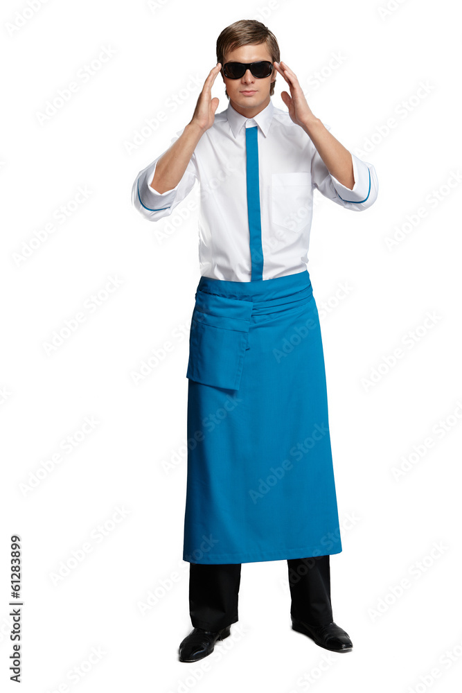 Young man in the form of a waiter or chef, white shirt Young man in the form of a waiter or chef, white shirt