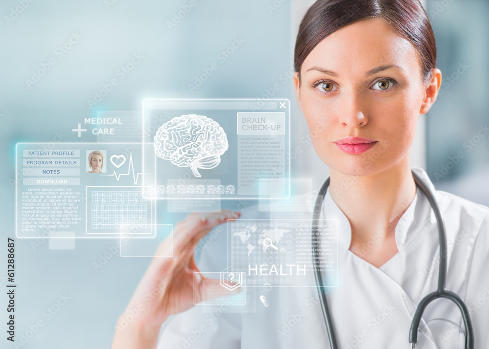 Calm doctor touching a medical interface in the hospital Calm doctor touching a medical interface in the hospital