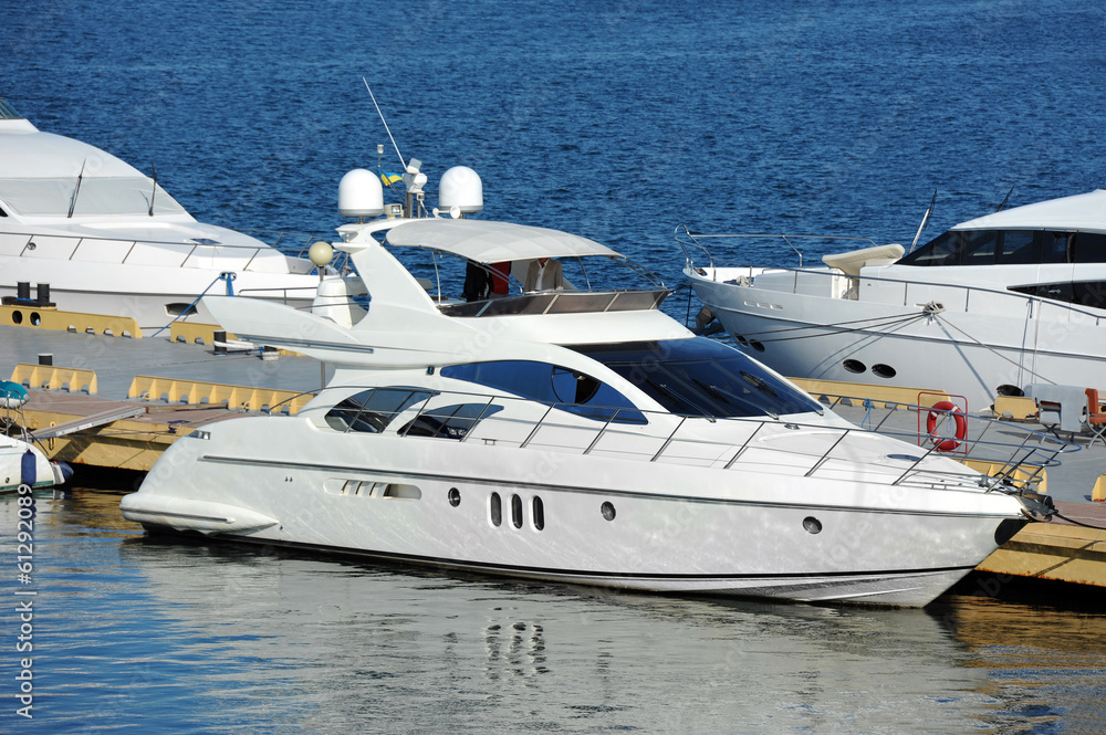 Fototapeta premium White motor yacht over harbor pier, Odessa, Ukraine