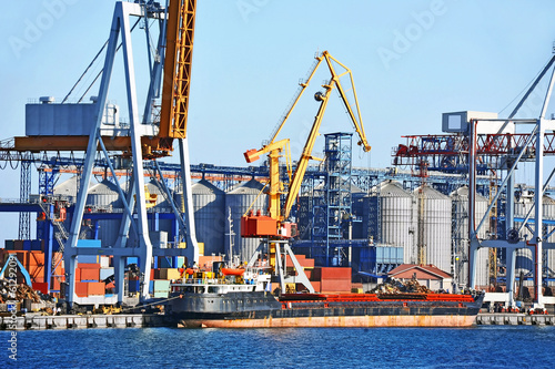 Bulk cargo ship under port crane bridge, Odessa, Ukraine © Unkas Photo