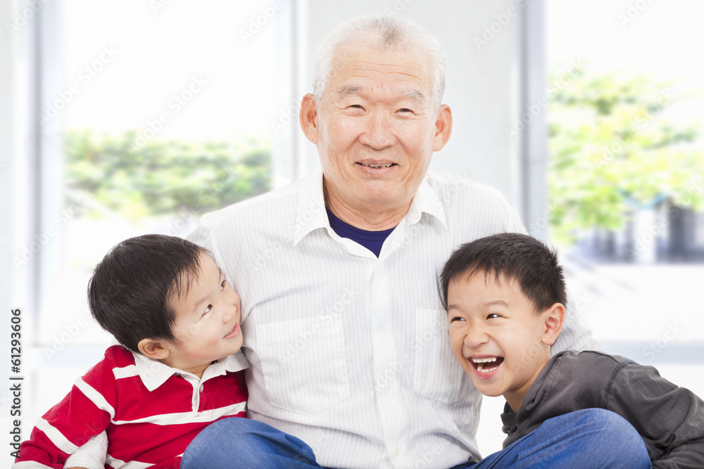 happy grandfather and grandchildren playing at home happy grandfather and grandchildren playing at home