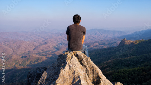 man on rock at mountain © moggara12