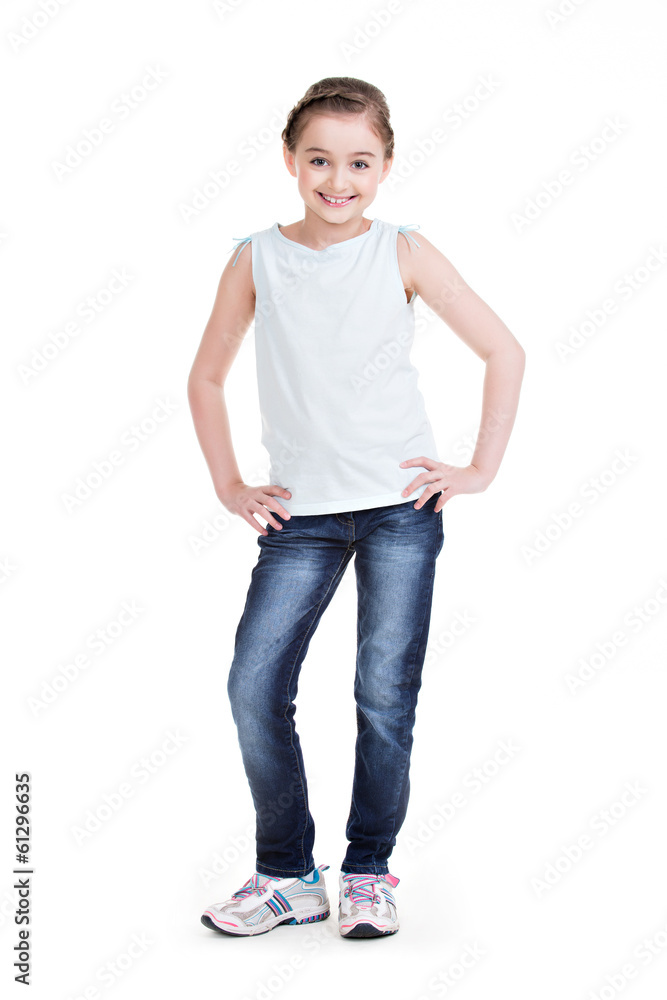 Pretty little girl in blue jeans in full growth.