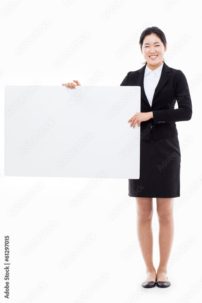 Young Asian business woman holding a blank banner Young Asian business woman holding a blank banner