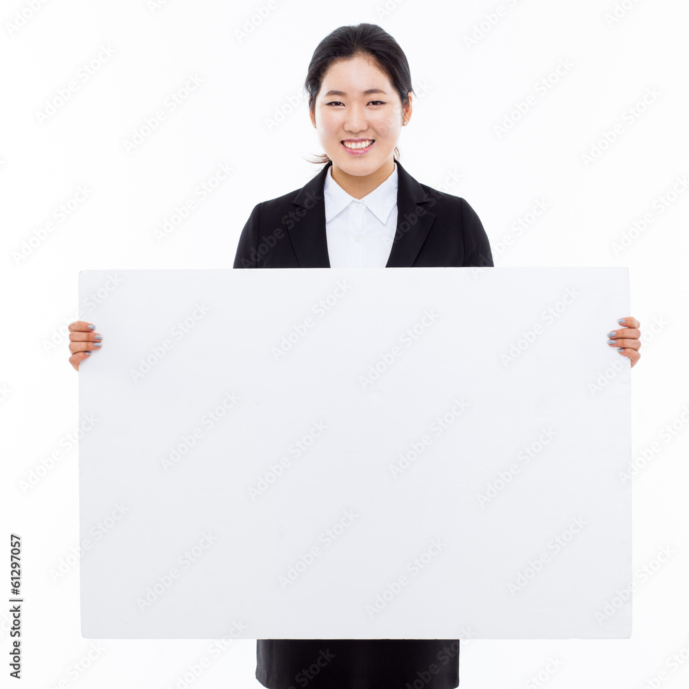Young Asian business woman holding a blank banner Young Asian business woman holding a blank banner