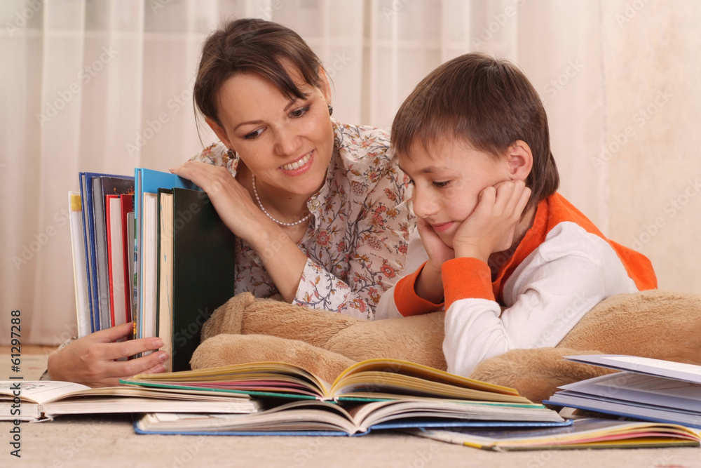 mother with her son reading a book mother with her son reading a book