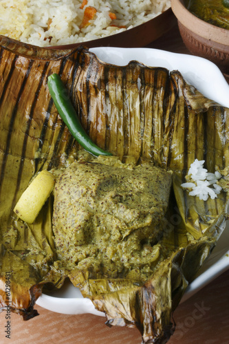 Bhetki paturi - Fish wrapped in a banana leaf photo