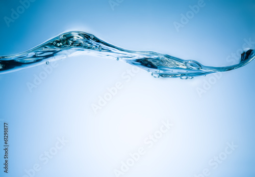 Abstract water wave with bubbles. Blue background
