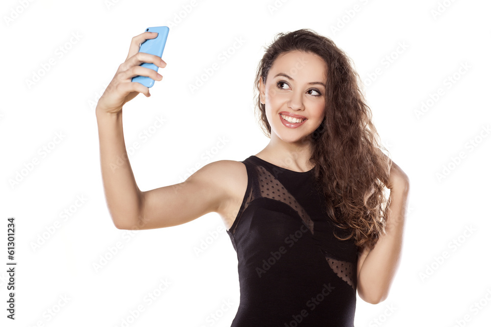 pretty teen girl taking selfies with her smart phone pretty teen girl taking selfies with her smart phone