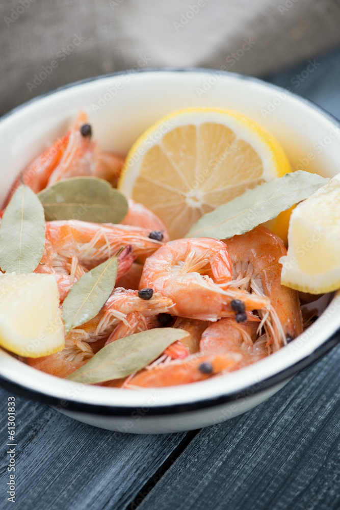 Enameled bowl with boiled king shrimps, close-up Enameled bowl with boiled king shrimps, close-up