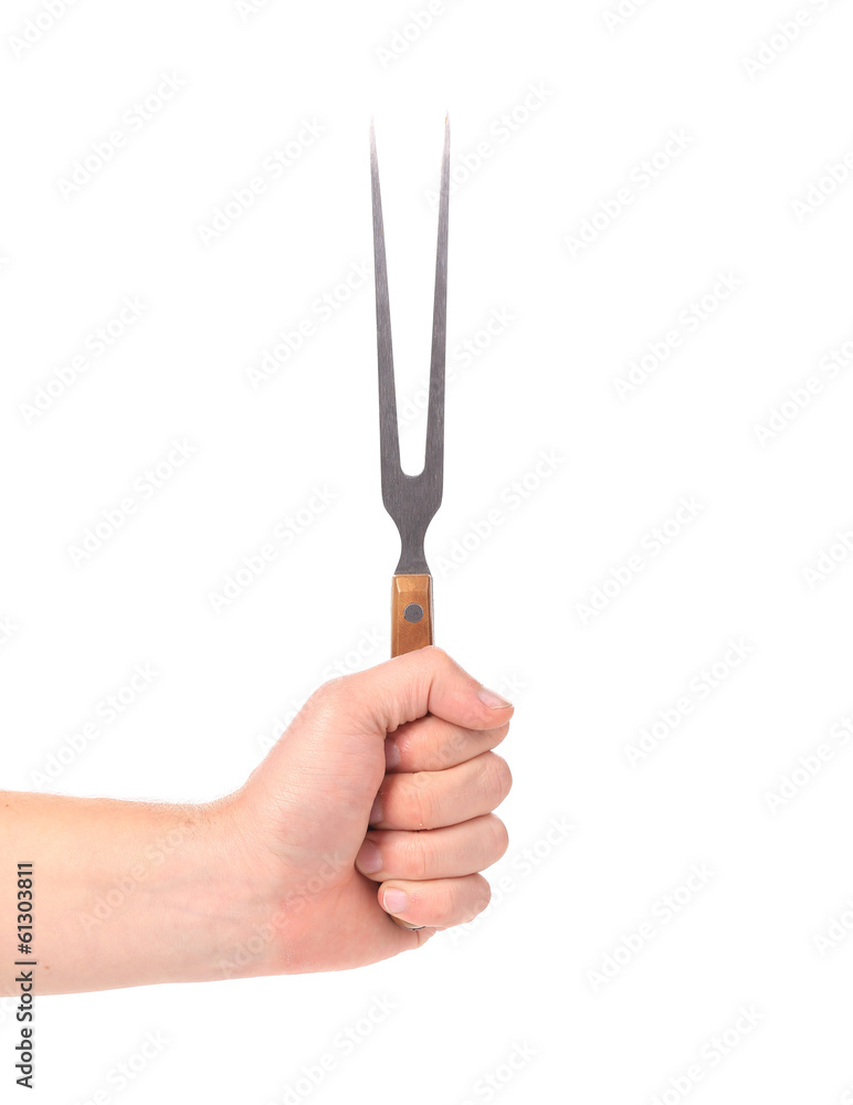 Close up of cheese fork in hand.