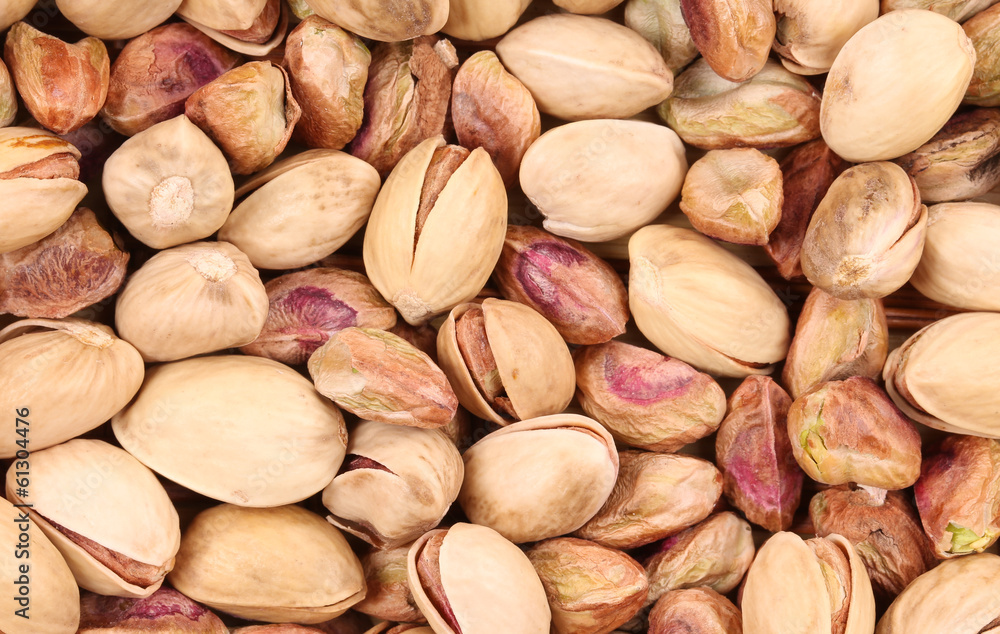 Close up of many pistachios.