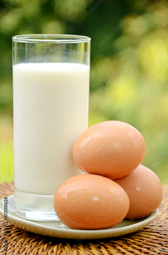 A glass of fresh milk and organic fresh eggs, simple and good protein and calcium diet source. A glass of fresh milk and organic fresh eggs, simple and good protein and calcium diet source.